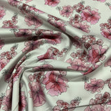 satinette Coton / élasthanne tissé  Fleur rose fond blanc